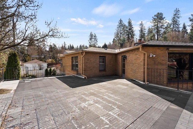 1733 S SE Blvd, Spokane, WA 99203 - back of house with brick siding and a chimney