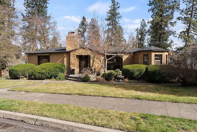 1733 S SE Blvd, Spokane, WA 99203 - mid-century modern home with a front yard, brick siding, and a chimney