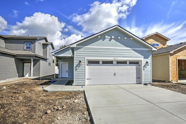 18517 E Michielli Ln, Spokane Valley, WA 99016 - view of front of home featuring an attached garage and concrete driveway