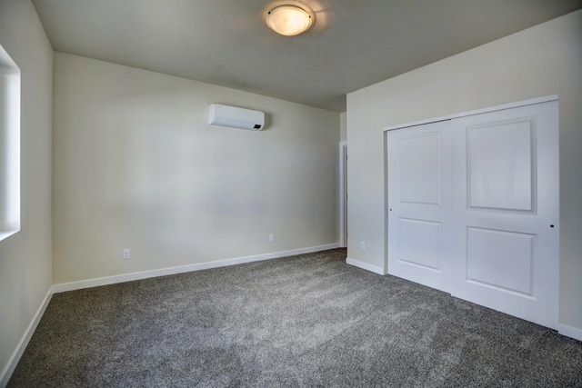 18517 E Michielli Ln, Spokane Valley, WA 99016 - unfurnished bedroom with a wall mounted air conditioner, carpet, baseboards, and a closet
