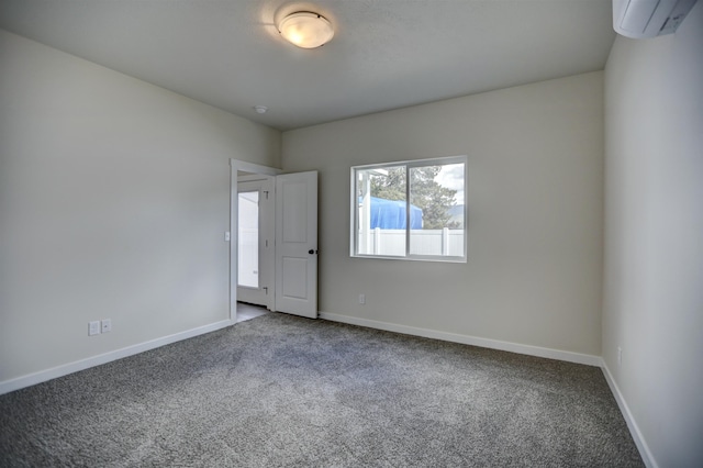 18517 E Michielli Ln, Spokane Valley, WA 99016 - carpeted empty room featuring an AC wall unit and baseboards
