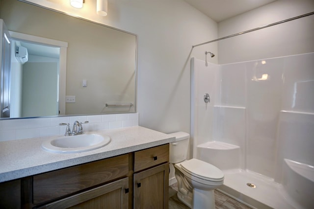18517 E Michielli Ln, Spokane Valley, WA 99016 - full bath with vanity, toilet, backsplash, and a shower