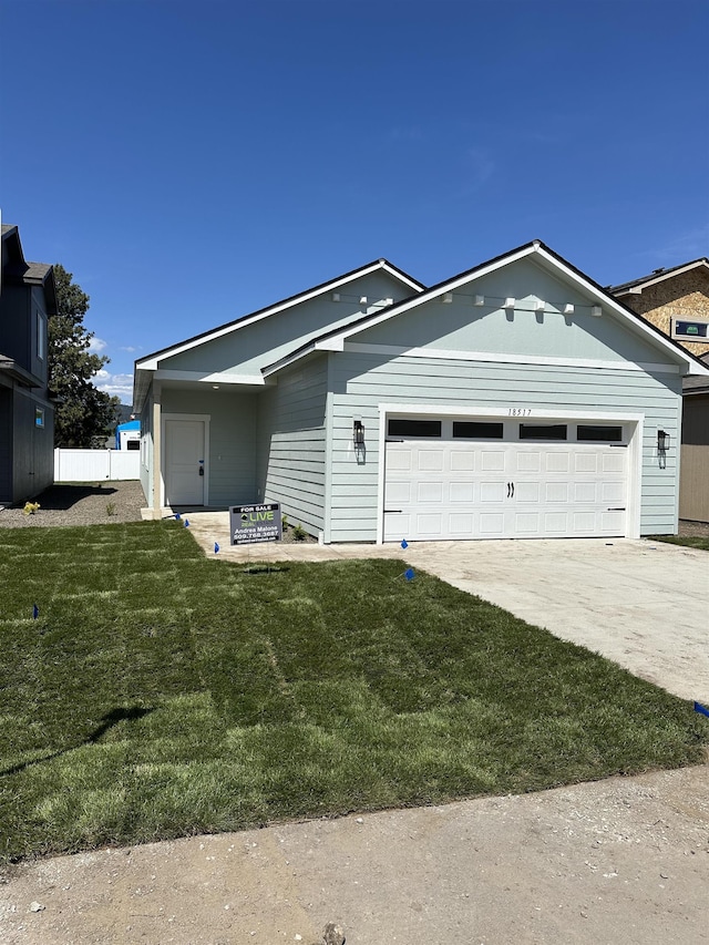 18517 E Michielli Ln, Spokane Valley, WA 99016 - single story home featuring a garage, a front lawn, and driveway