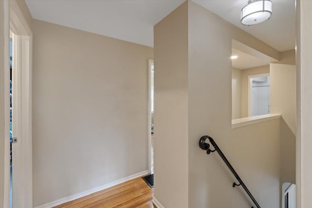 127 W 25th Ave, Spokane, WA 99203 - hall with baseboards, wood finished floors, and an upstairs landing