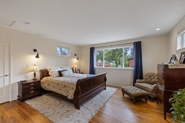 127 W 25th Ave, Spokane, WA 99203 - bedroom featuring baseboards, multiple windows, and light wood-type flooring