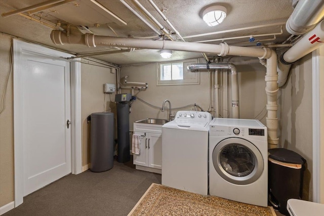 127 W 25th Ave, Spokane, WA 99203 - laundry area featuring washing machine and clothes dryer, a sink, and dark carpet