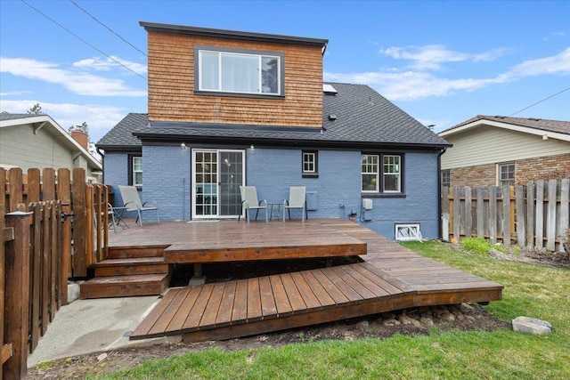 127 W 25th Ave, Spokane, WA 99203 - back of property featuring brick siding, fence, and a deck