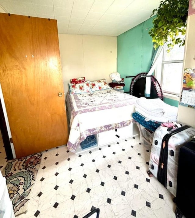 bedroom with tile patterned floors