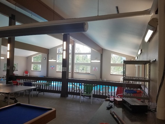 rec room featuring plenty of natural light and high vaulted ceiling