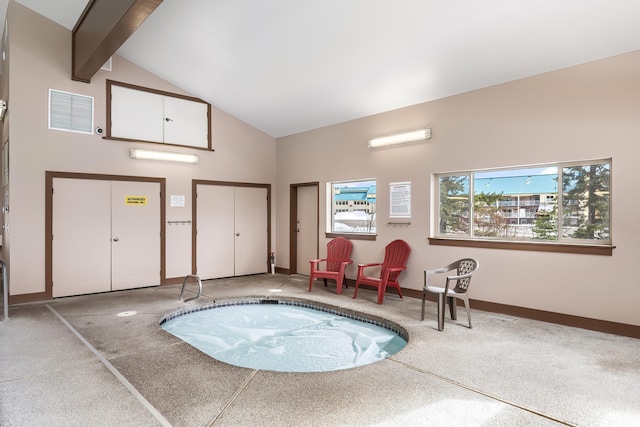 view of swimming pool with an indoor in ground hot tub