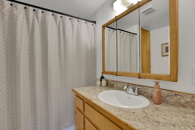 404 N Washington Ave, Newport, WA 99156 - bathroom with visible vents and vanity