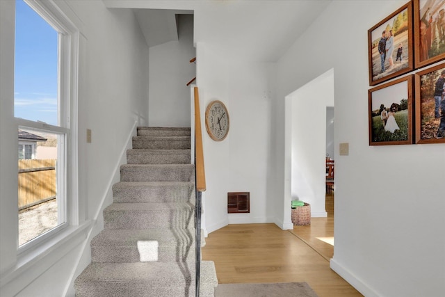 404 N Washington Ave, Newport, WA 99156 - stairway featuring baseboards, visible vents, and wood finished floors