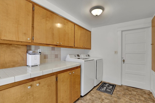 404 N Washington Ave, Newport, WA 99156 - washroom with washer and dryer and cabinet space