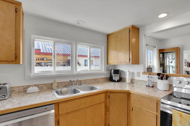 404 N Washington Ave, Newport, WA 99156 - kitchen with tile counters, recessed lighting, a sink, and stainless steel appliances