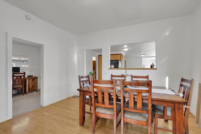 404 N Washington Ave, Newport, WA 99156 - dining area featuring baseboards and light wood finished floors
