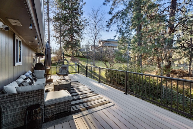 wooden deck featuring outdoor lounge area