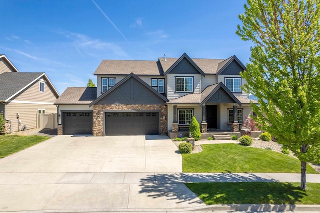2019 S Incline Dr, Greenacres, WA 99016 - craftsman-style house featuring a garage, concrete driveway, covered porch, roof with shingles, and stone siding