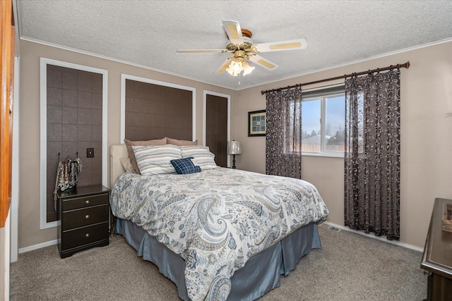bedroom with ornamental molding, ceiling fan, light colored carpet, and a textured ceiling
