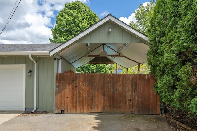 305 S Steen Rd, Veradale, WA 99037 - view of side of home with a shingled roof and an attached garage