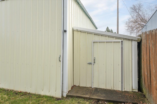 view of shed with fence