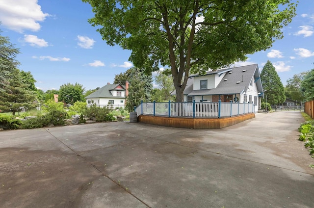 rear view of house with fence