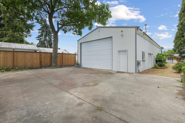 detached garage with concrete driveway