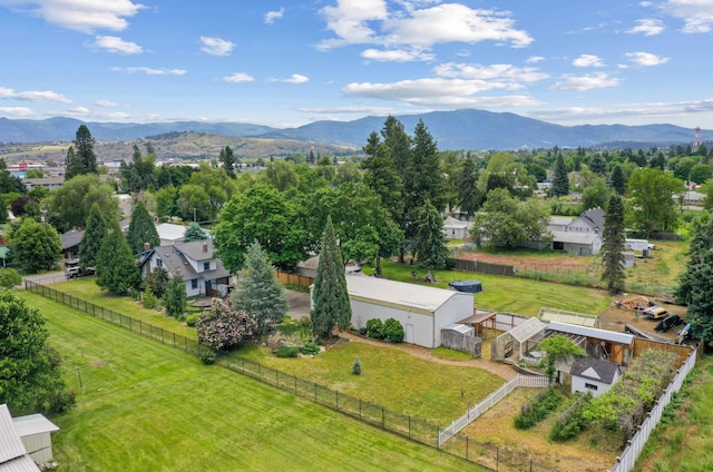 birds eye view of property featuring a mountain view