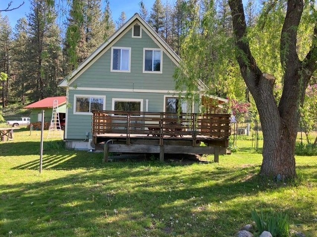 3434G Rockcut Rd, Kettle Falls, WA 99141 - back of house with a wooden deck and a yard