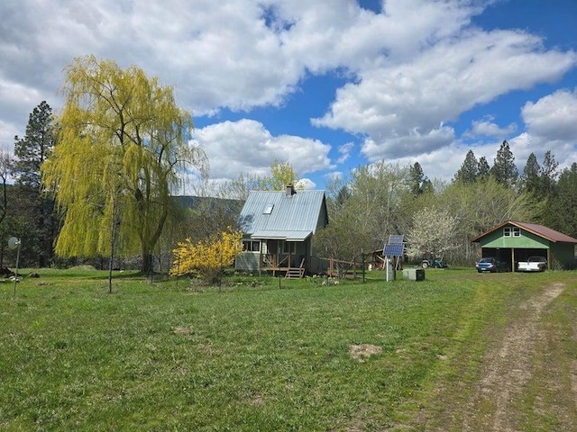 3434G Rockcut Rd, Kettle Falls, WA 99141 - view of green lawn with a detached carport