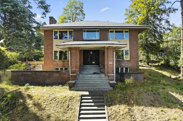 540 E Rockwood Blvd, Spokane, WA 99202 - view of front facade with brick siding, covered porch, and a chimney