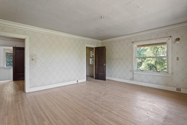 540 E Rockwood Blvd, Spokane, WA 99202 - empty room with baseboards, wallpapered walls, and wood finished floors