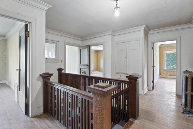 540 E Rockwood Blvd, Spokane, WA 99202 - corridor with baseboards, an upstairs landing, light wood-type flooring, and crown molding