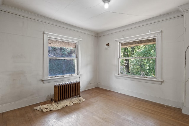 540 E Rockwood Blvd, Spokane, WA 99202 - unfurnished room featuring radiator heating unit, light wood-style flooring, and baseboards