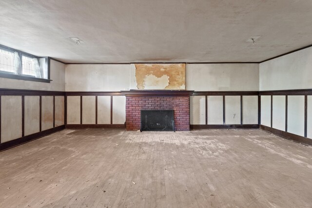 540 E Rockwood Blvd, Spokane, WA 99202 - unfurnished living room featuring wood finished floors and a fireplace
