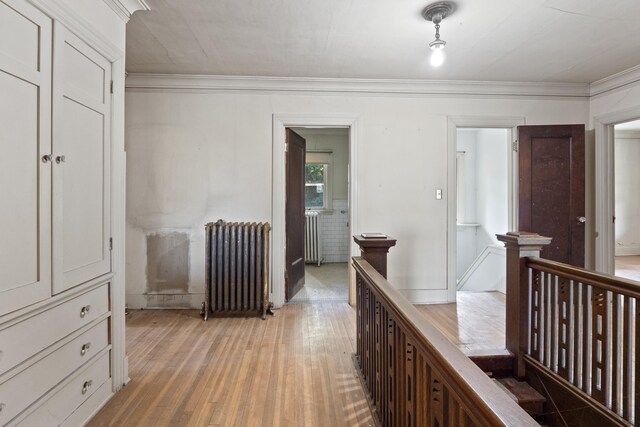 540 E Rockwood Blvd, Spokane, WA 99202 - corridor with light wood-style floors, radiator, ornamental molding, and an upstairs landing
