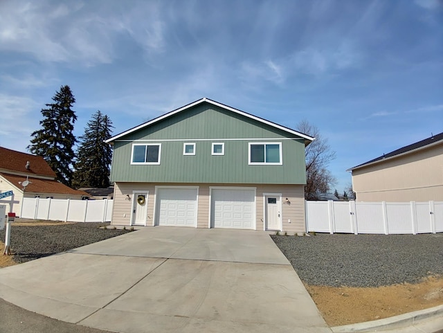 4907 E 6th Avenue 4909E 6Th Ave, Spokane Valley, WA 99212 - view of front facade with an attached garage, driveway, and fence