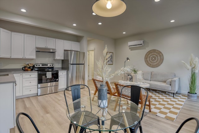 4907 E 6th Avenue 4909E 6Th Ave, Spokane Valley, WA 99212 - dining space with light wood finished floors, baseboards, recessed lighting, and a wall unit AC