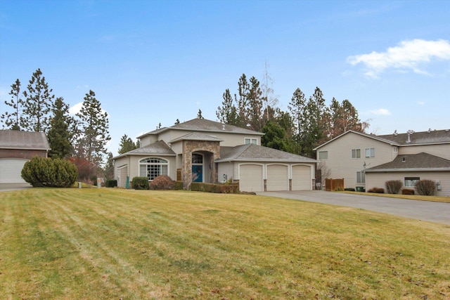 4357 S Greystone Ln, Spokane, WA 99203 - view of front facade featuring driveway, an attached garage, and a front lawn