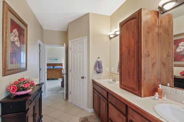 4357 S Greystone Ln, Spokane, WA 99203 - ensuite bathroom featuring tile patterned floors, double vanity, ensuite bath, and a sink