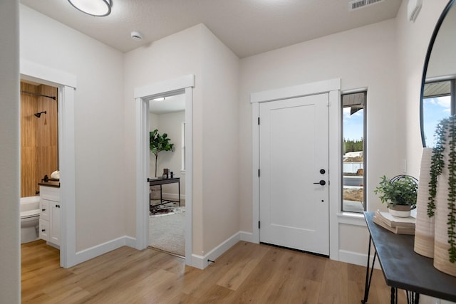 13310 N Starling Ln, Spokane, WA 99208 - entryway with light wood-style floors, baseboards, and visible vents