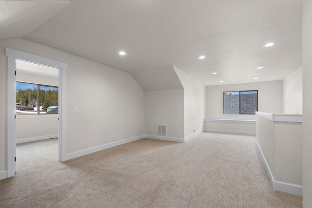 13310 N Starling Ln, Spokane, WA 99208 - bonus room with baseboards, lofted ceiling, visible vents, and carpet floors