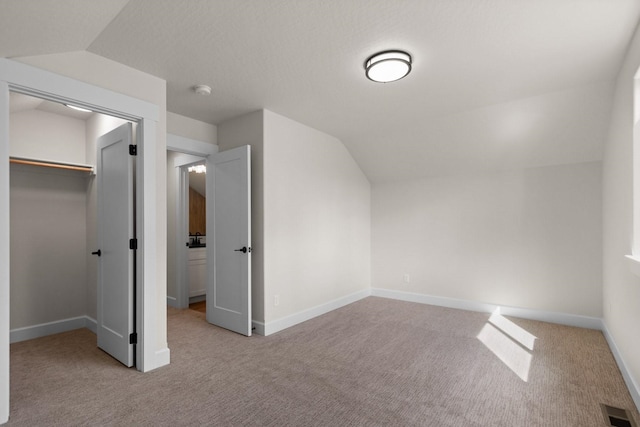 13310 N Starling Ln, Spokane, WA 99208 - bonus room with baseboards, lofted ceiling, visible vents, and carpet floors