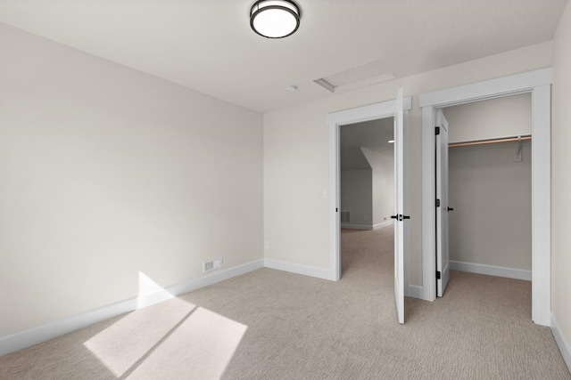 13310 N Starling Ln, Spokane, WA 99208 - unfurnished bedroom featuring visible vents, baseboards, attic access, and light colored carpet
