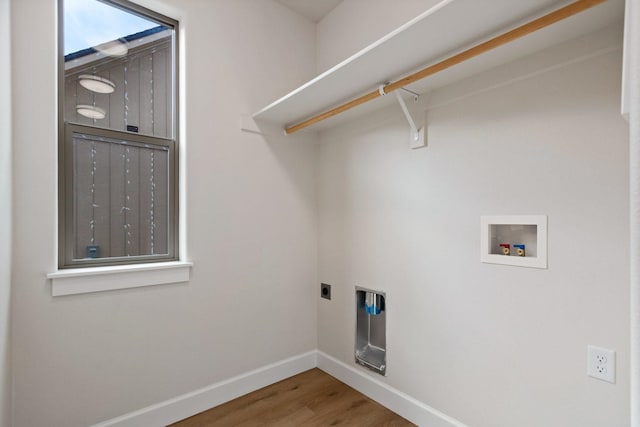 13310 N Starling Ln, Spokane, WA 99208 - washroom featuring laundry area, electric dryer hookup, wood finished floors, washer hookup, and baseboards