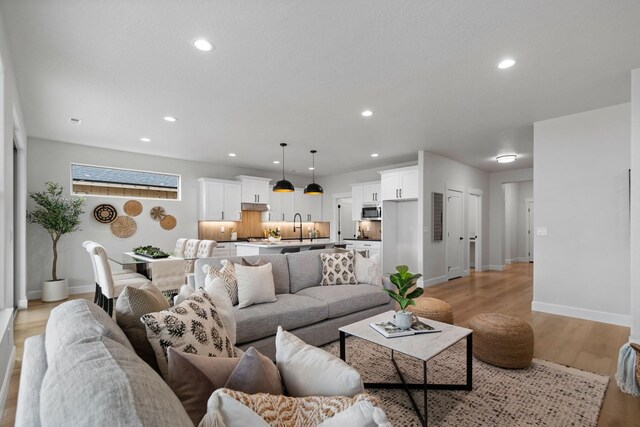 13310 N Starling Ln, Spokane, WA 99208 - living area with baseboards, recessed lighting, and light wood-style floors