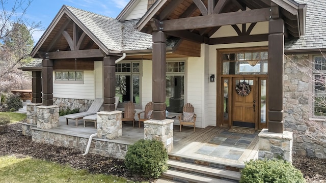 13615 N Riverbluff Ln, Spokane, WA 99208 - property entrance featuring stone siding and covered porch