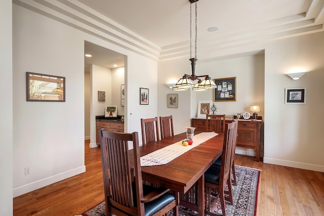 13615 N Riverbluff Ln, Spokane, WA 99208 - dining space featuring light wood-style flooring, baseboards, and ornamental molding