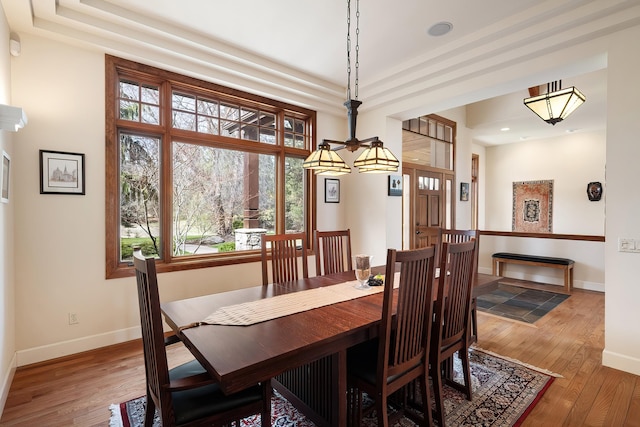 13615 N Riverbluff Ln, Spokane, WA 99208 - dining room with recessed lighting, wood-type flooring, baseboards, and a raised ceiling