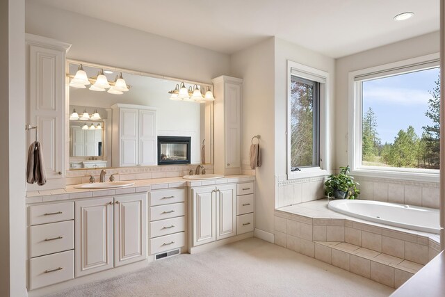 13615 N Riverbluff Ln, Spokane, WA 99208 - full bath featuring double vanity, a bath, visible vents, and a sink