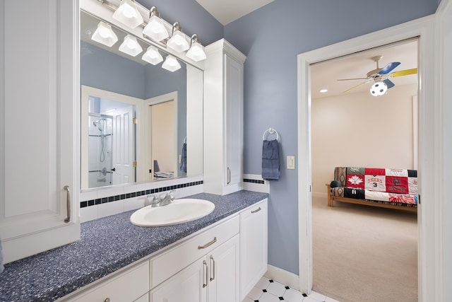 13615 N Riverbluff Ln, Spokane, WA 99208 - full bathroom featuring walk in shower, a ceiling fan, vanity, and baseboards